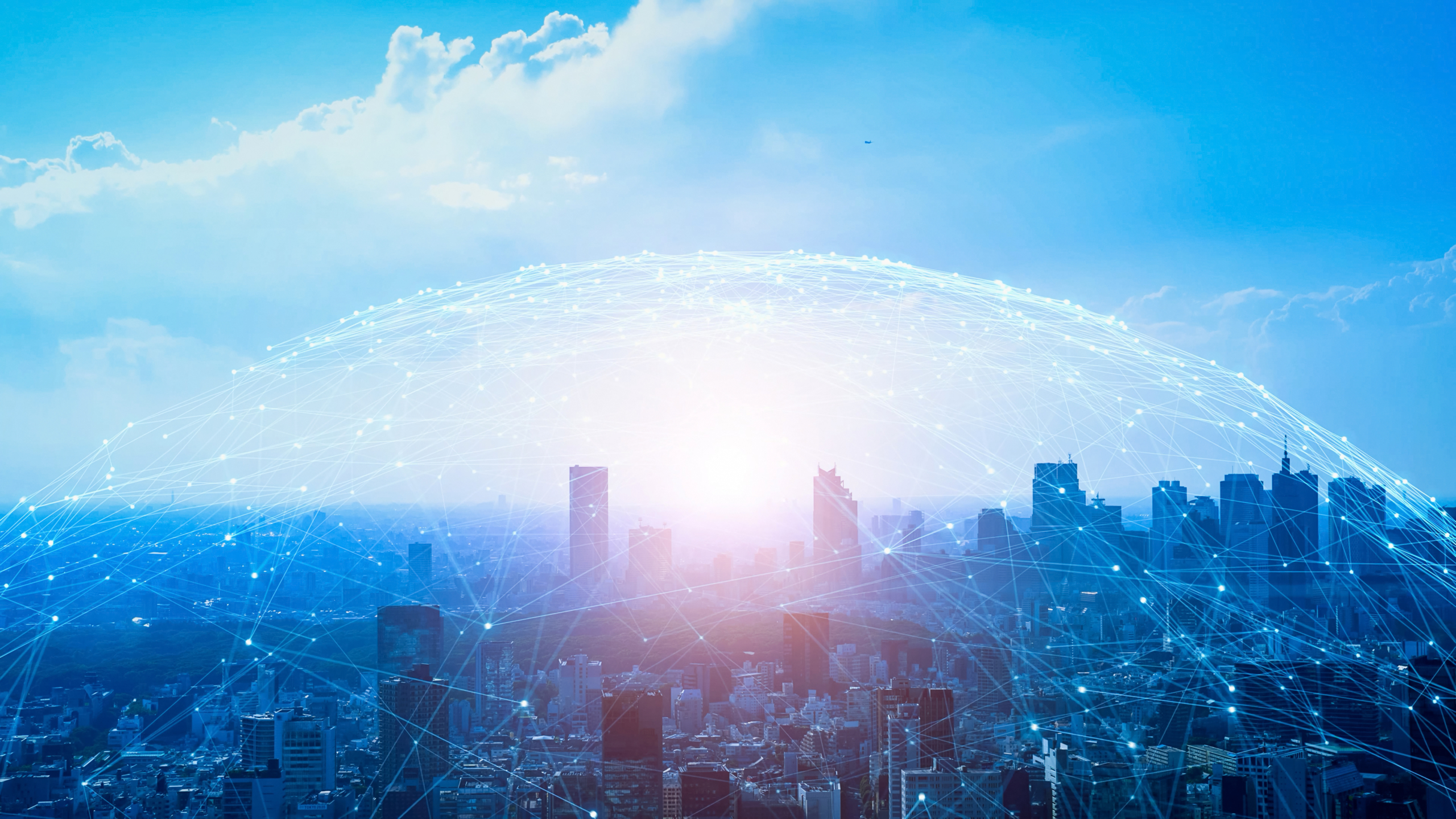 City skyline with digital network overlay